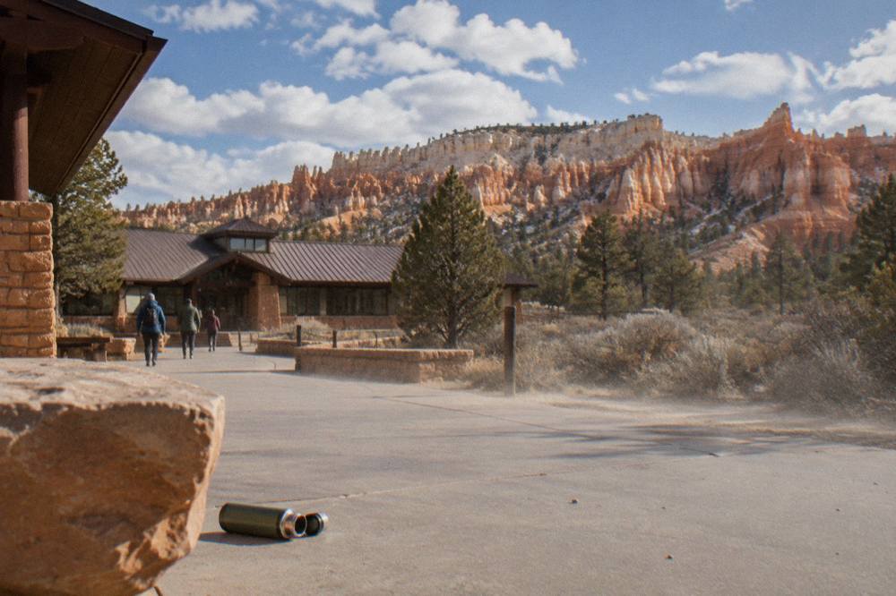Sunlit hoodoos of the Bryce Amphitheater under a partly cloudy sky