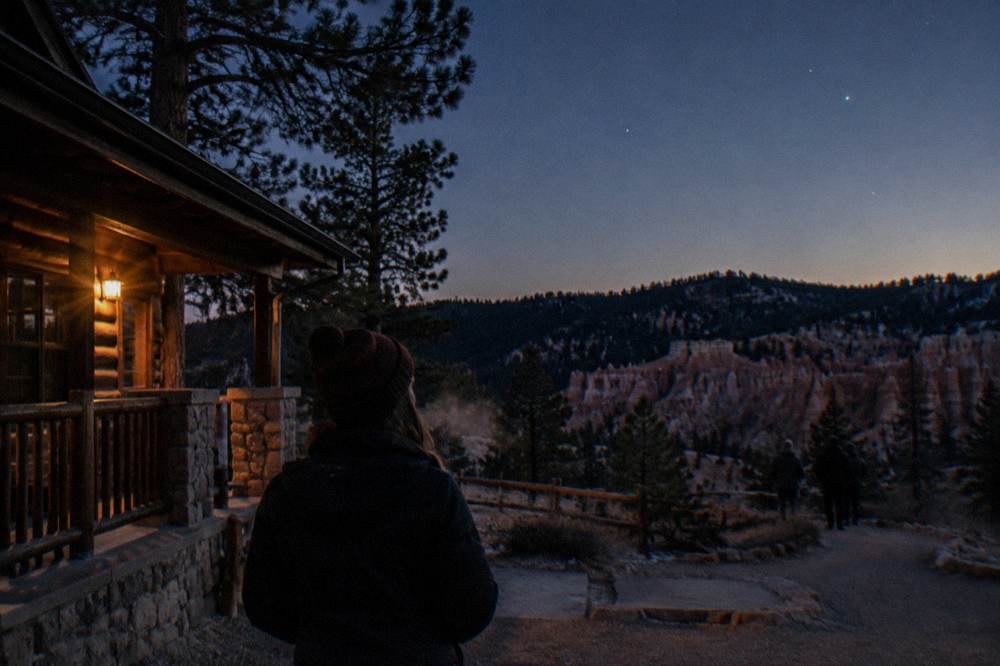 Early evening stars appearing above a dark ridgeline near Bryce Canyon City
