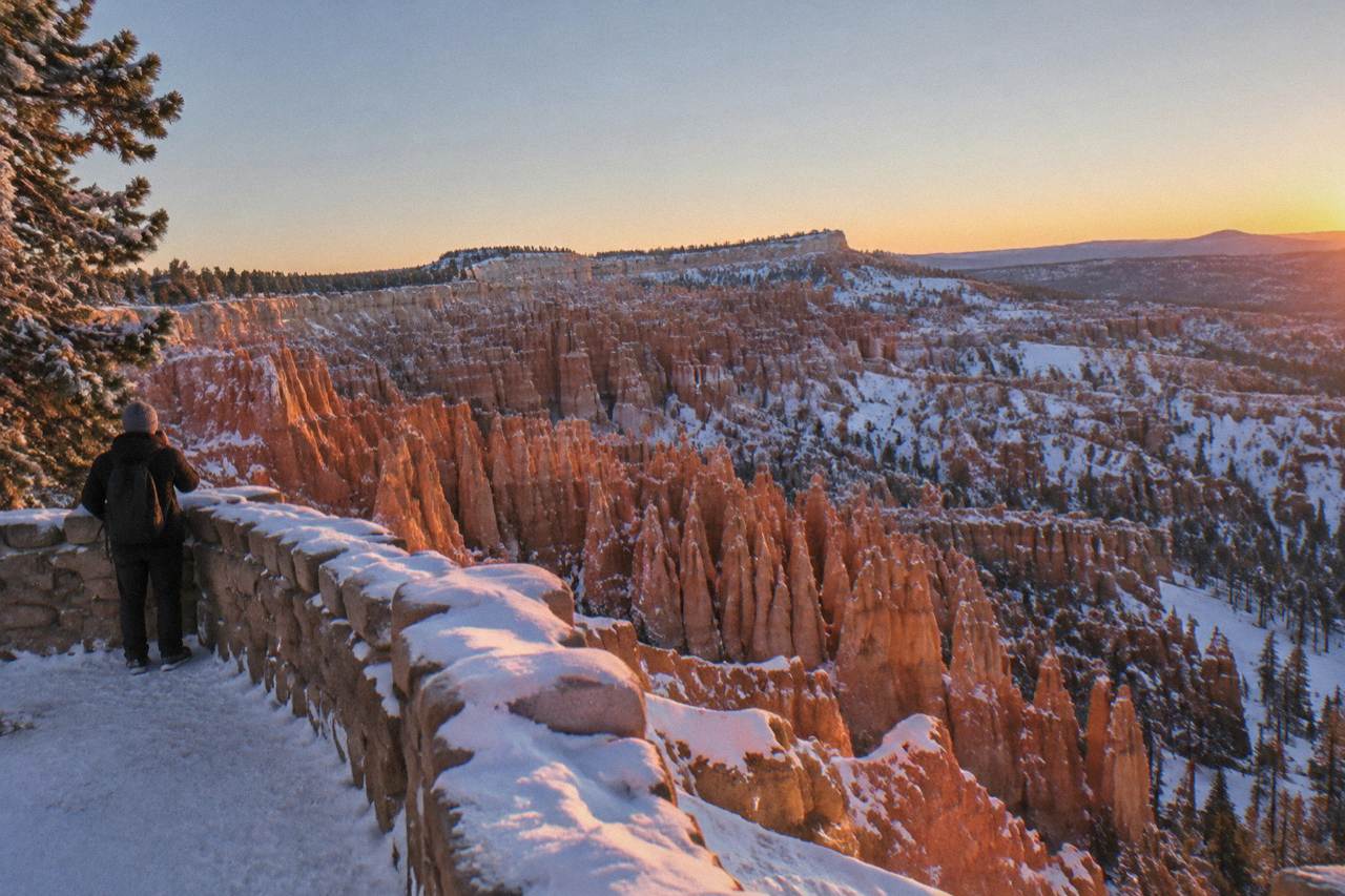 Sunrise light on the hoodoo formations of the Bryce Amphitheater from a snow-dusted overlook