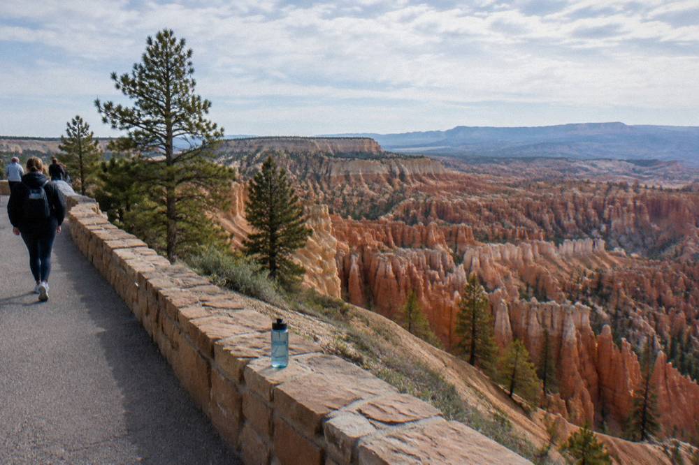Paved overlook walkway along the rim above rows of hoodoos