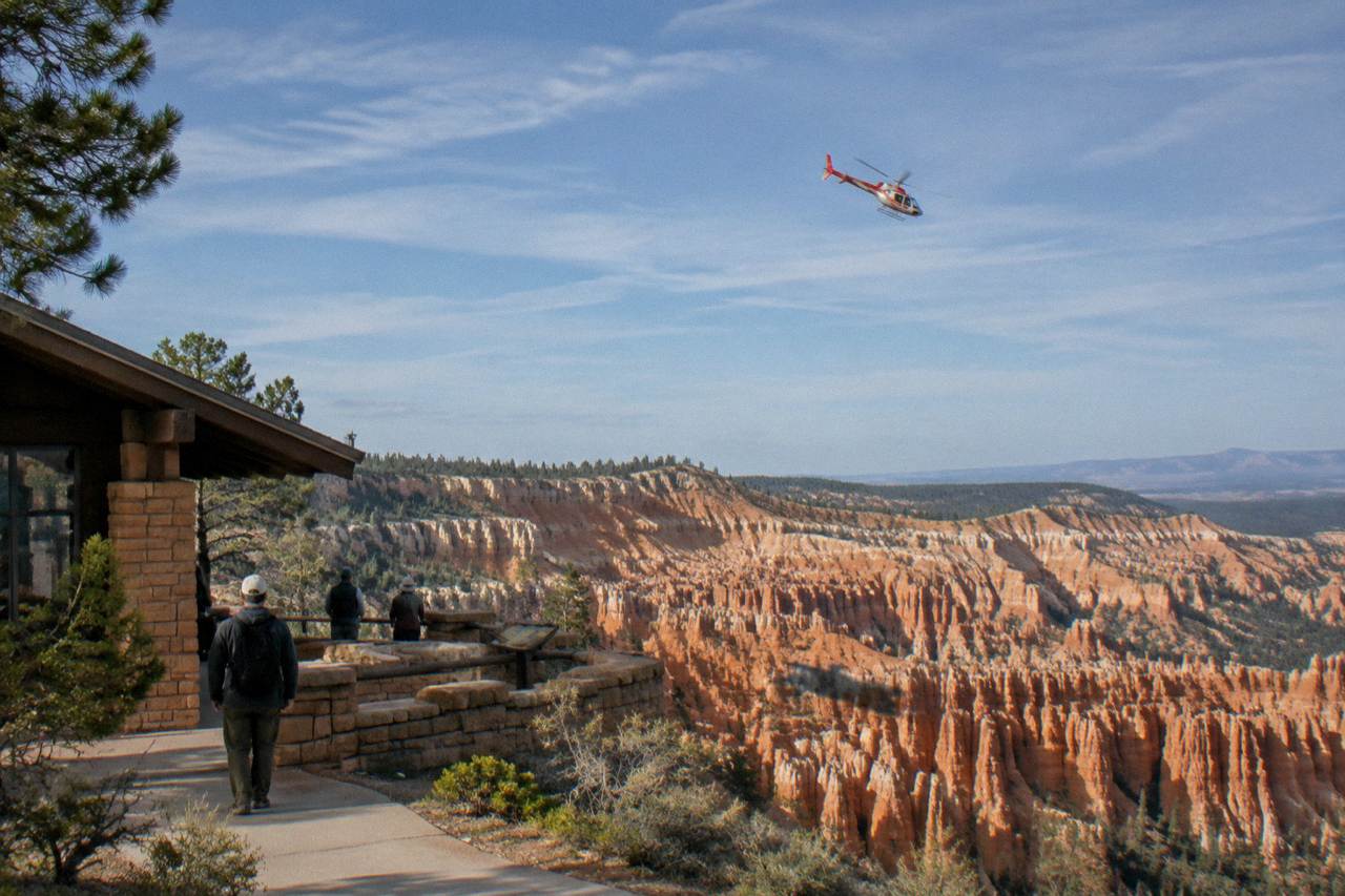 Helicopter flying above red rock hoodoo formations at Bryce Canyon