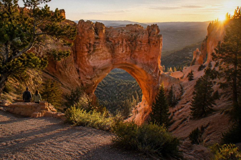Golden late-afternoon light on hoodoo formations before nightfall