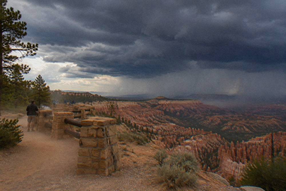 Dark thunderstorm clouds building over the Bryce Canyon plateau in late afternoon